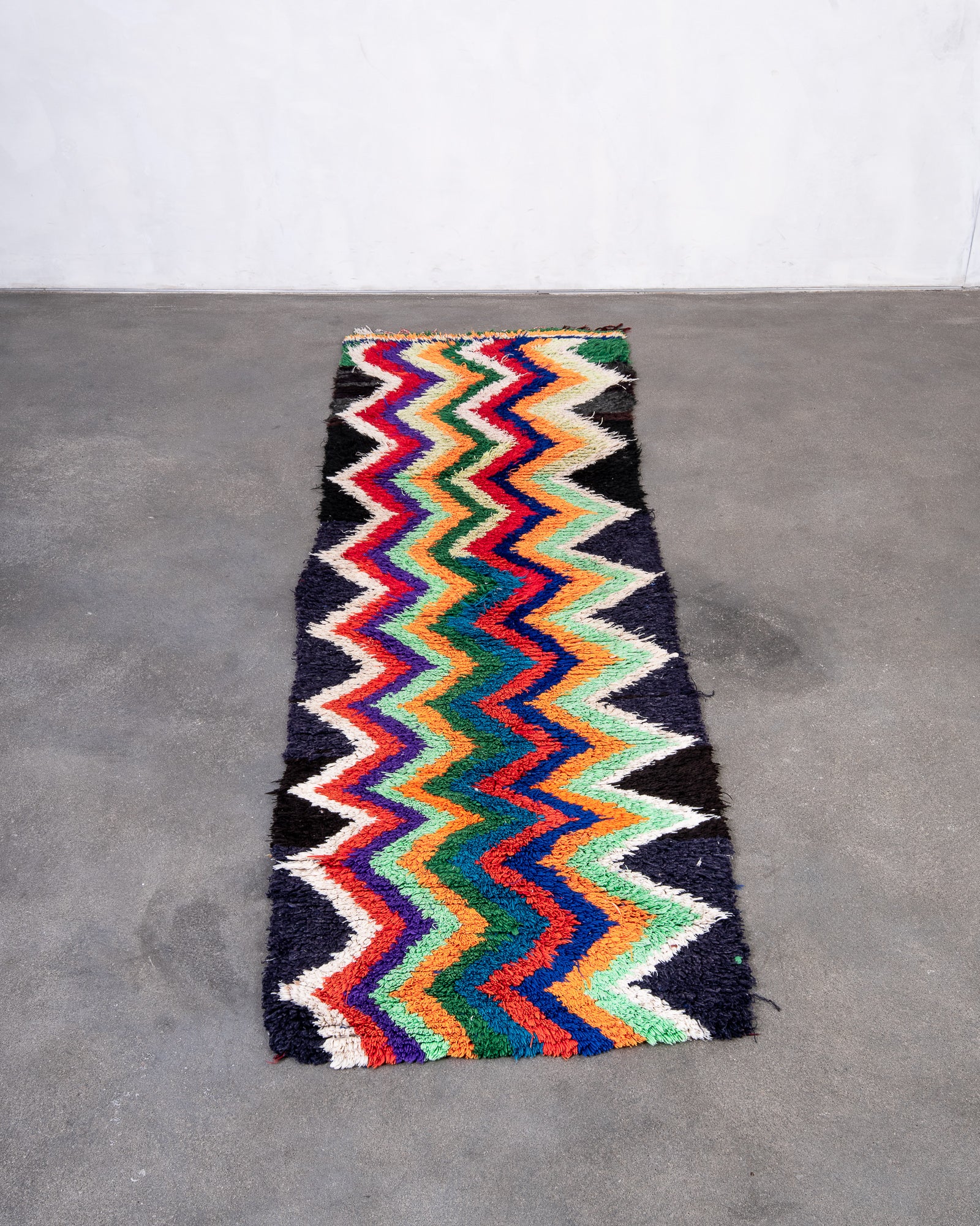Modern designer vintage handcrafted cotton Berber rug from Morocco. Boucherouite with beautiful colors and patterns.
